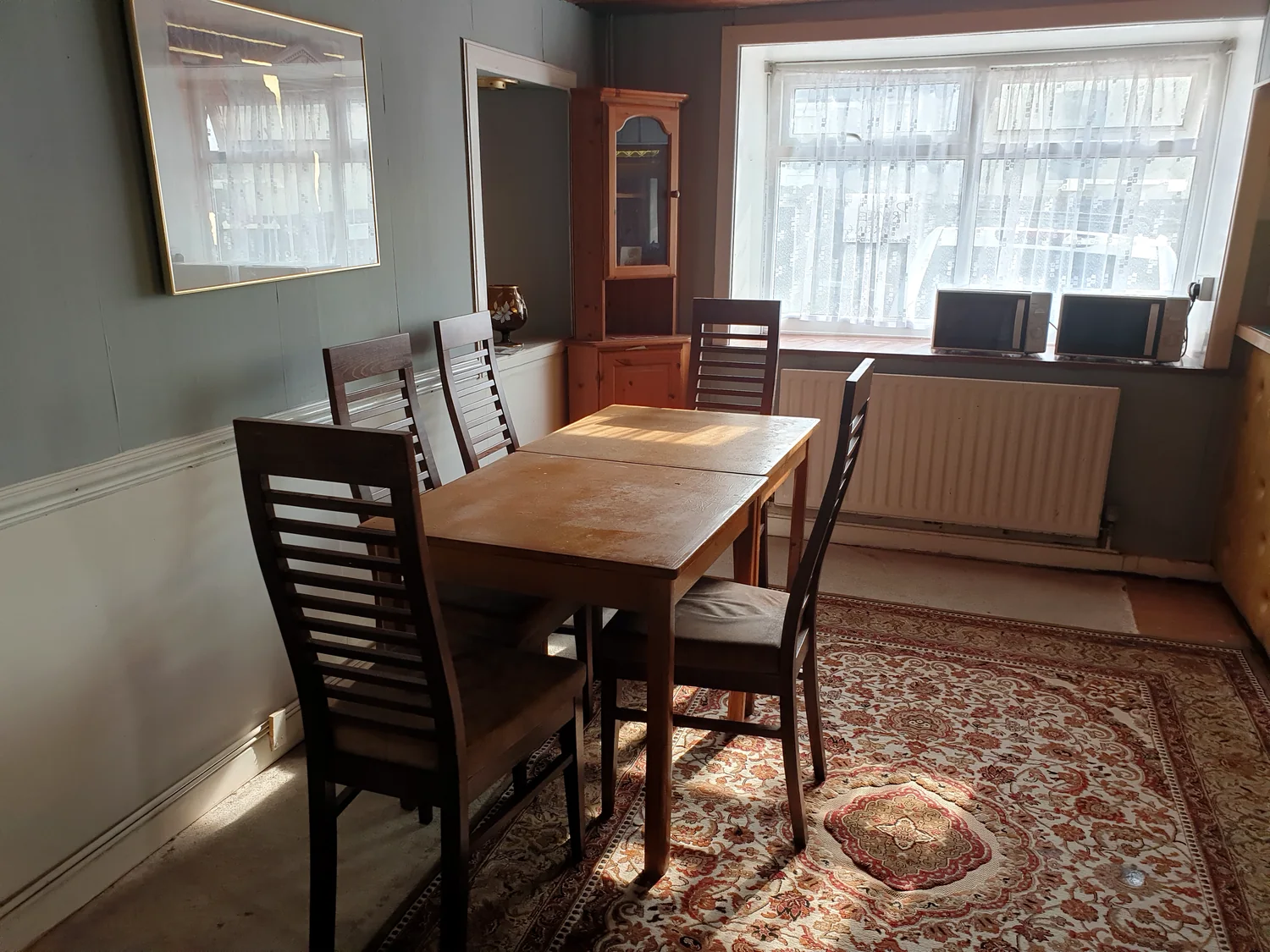 Communal dining area with table and chairs